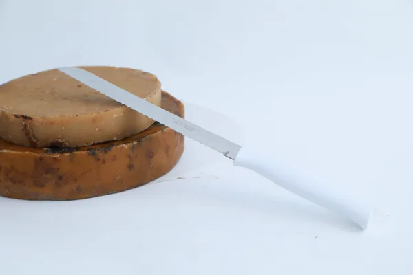Cuchillo desoperculador con mango plastico;